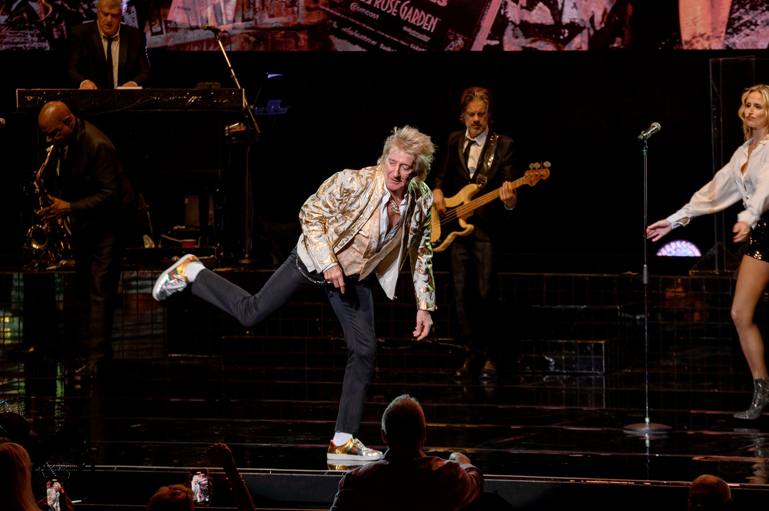 Rod Stewart dancing on stage while performing in Vegas