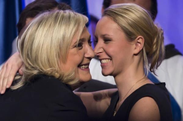 Leader of the French far-right political party, National Front, Marine Le Pen (L), and candidate for the Northern Nord-Pas-de-Calais Picardie region embraces Marion Marechal-Le Pen, candidate for the Provence-Alpes-Cote d'Azur (PACA) region.