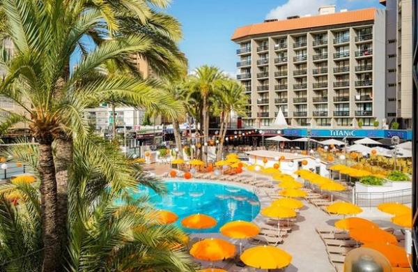 Benidorm's Marina Hotel with pool, sun loungers and umbrellas